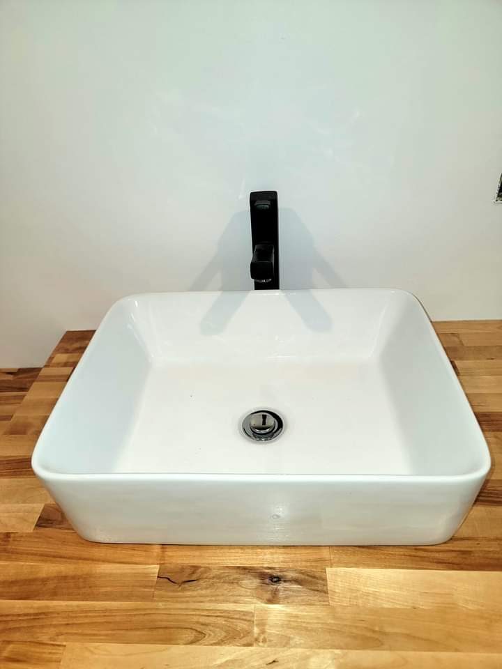 Vessel sink on a wood vanity — bathroom finish detail, Laurens County GA