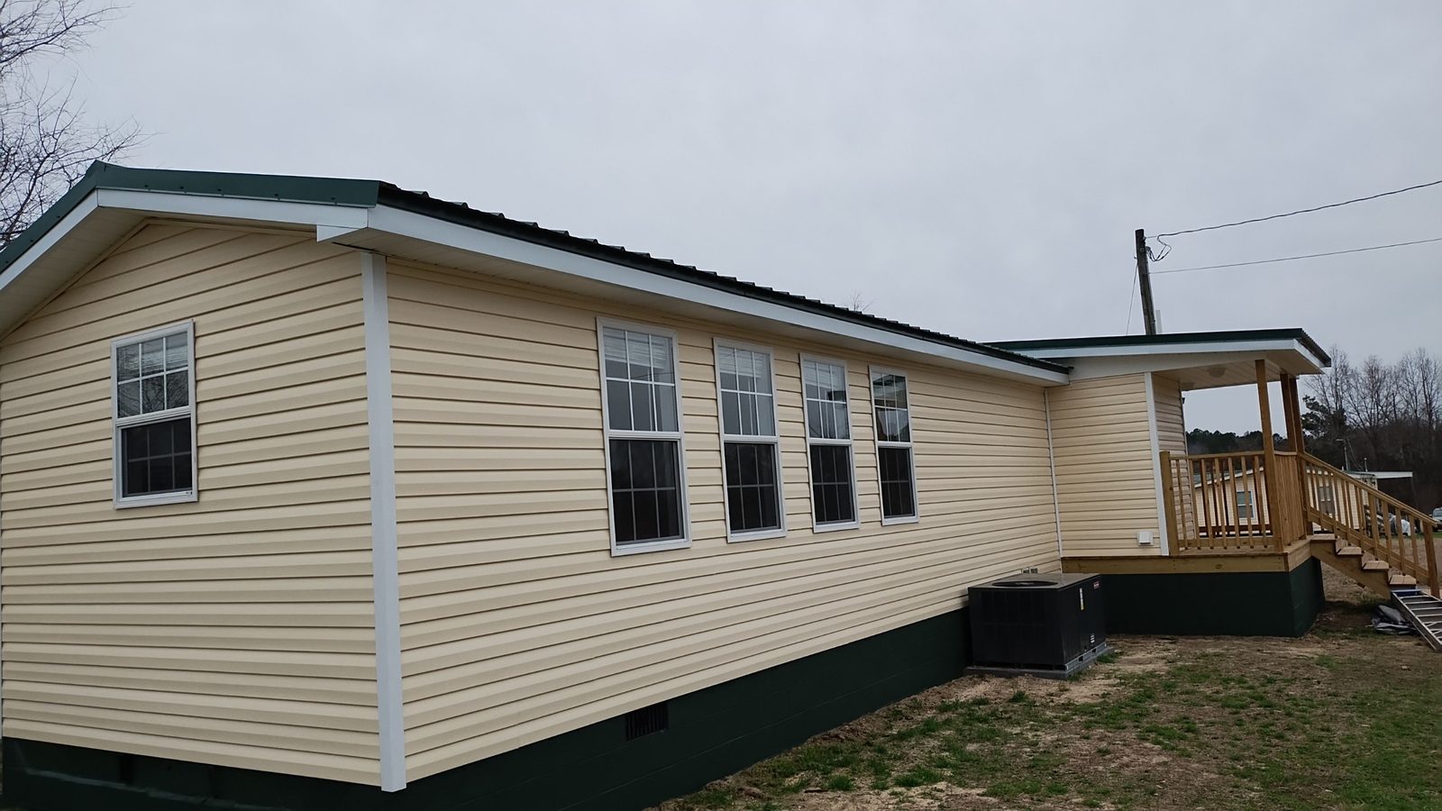 Home exterior with new siding and skirting — Middle Georgia