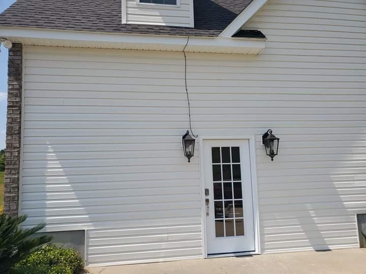 Exterior siding, door and finish work completed by MMAC Renovation