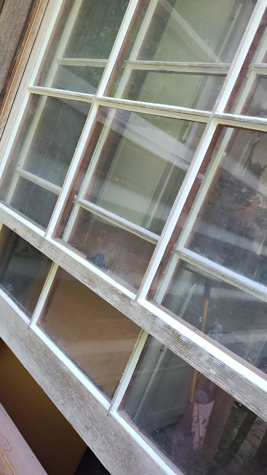 Newly installed window with fresh glazing and trim by MMAC Renovation