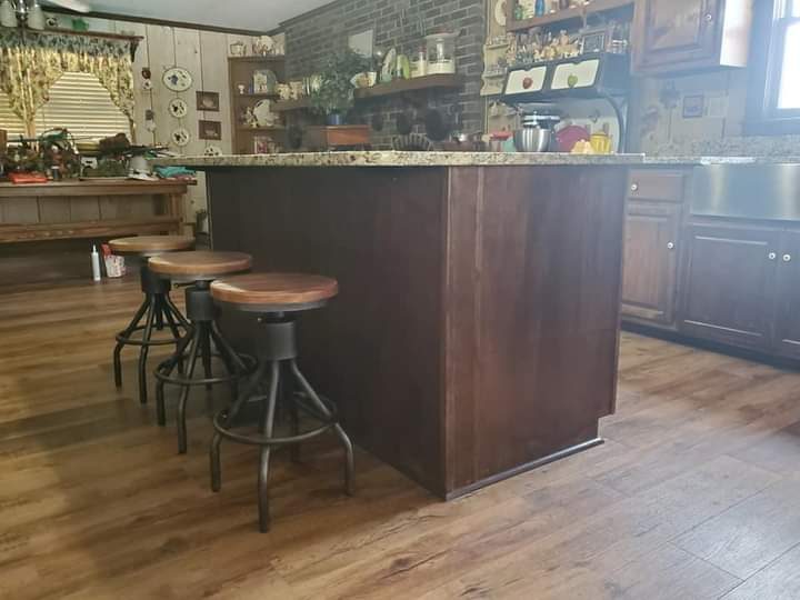 Custom wood kitchen bar with stools and dark cabinetry — Middle Georgia